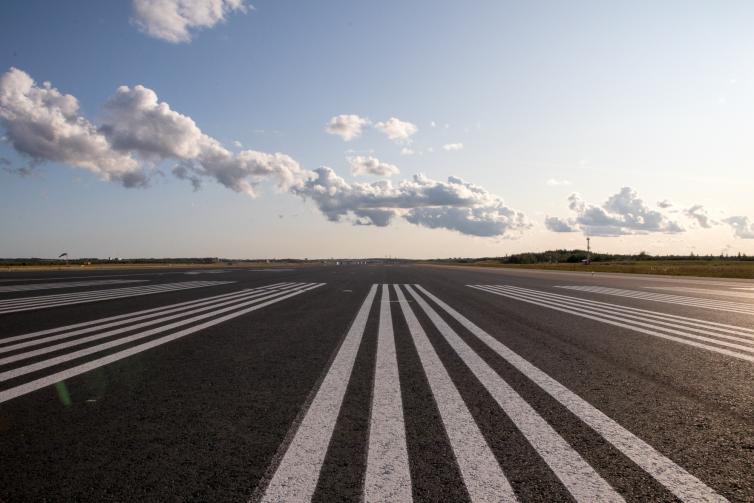 Empty runway on 3PM sun.