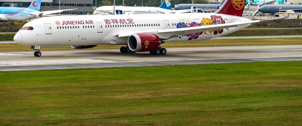 Juneyao Air airplane on a runway.